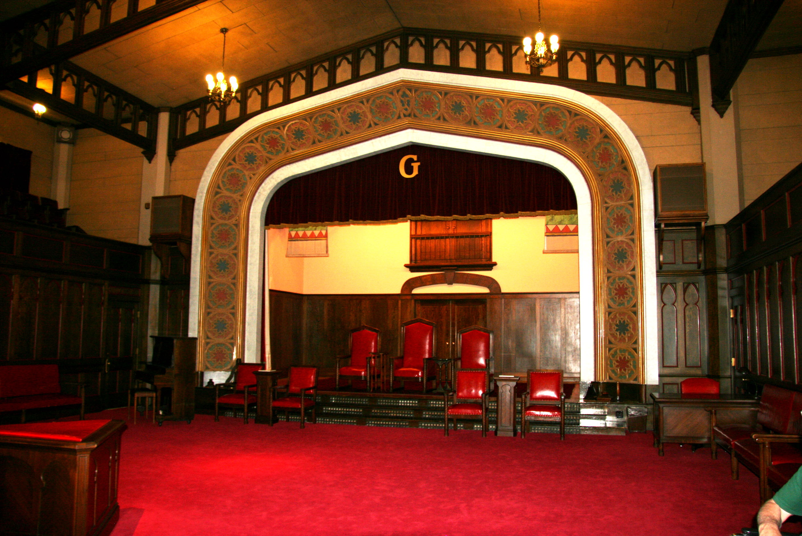 The Masonic Temple, Utah — The Gothic Room. Note symbolic triangle in the keystone alter in lower left corner.. — This is the largest lodge room, 65'x56', with seats in the balcony.
