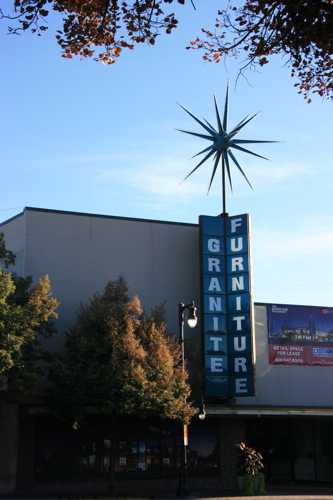 Landmark Granite Furniture Store. — Many old buildings are being replaced.